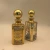 Import 150/250ml Plating Gold Essential Oil Perfume Bottles, Display Cosmetic Bottles, Galvanized Glass Bottles from China