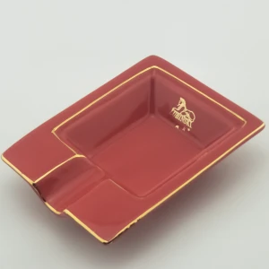 Best selling black ceramic ashtray with golden edge with one rest with customized logo for sale