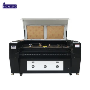 Singapore agent hot sale 1610 150w auto feed two axis 4 head home fabric leather curtain laser cutting machine