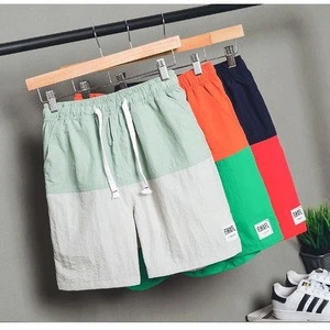 The new casual summer splicing leisure five plus-size sweatpants beach shorts for man