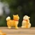 Import BAIUFOR Animals Miniatures Little Cute Yellow Dogs Resin Crafts DIY Terrarium Figurines Mini Garden Decor from China