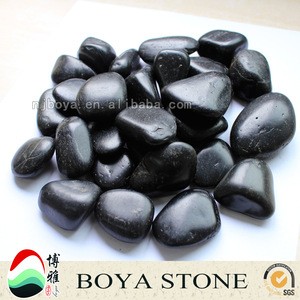 Black natural pebble stones, river rock for landscaping