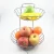 Import Hot Sale Amazon Metal Wire Home Kitchen Storage Fruit Basket Rack Home Decor Iron 2 Tiers Fruit Vegetable Basket Stand from China
