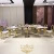 Import luxury design gold stainless steel leg MDF top 10 seater half round dining table from China