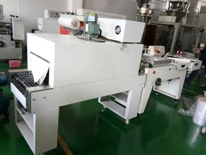 Pneumatic shrink wrapping machine