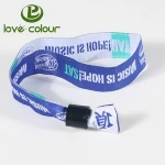 Polyester material fabric wristband with a 1 way black plastic lock
