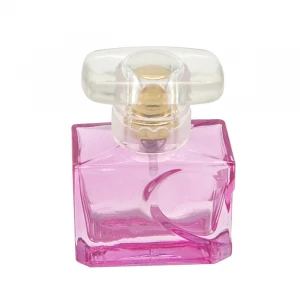small square empty glass perfume bottle with lovely heart both on the bottle and the cap
