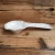 Import Wholesale relief white color antique ceramic kitchen cooking serving ceramic spoon rest holder from China