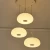 Import cheap fancy 3 lamps long round plastic cover shade led suspended pendent ceiling lighting with remote control from China