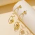 Import JUHU 2021 New gold stud alloy ear buckle spring wound around the mesh ball drop earring punk round ball alloy jewelry for women from China