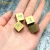 Import Wholesale supply logo custom gold color plated titanium dice ,pure titanium square dice decoration from China