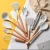 Import 11 piece marble silicone kitchen cooking tools wood handle silicone kitchen utensil with holder from China