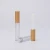 Import 2.5ml clear round bottle cosmetic packaging with applicator lip gloss tubes with bamboo top from China