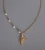 Import France Fashion Imitation Pearl Fish Tail Pendant Necklace Titanium Steel 18k Gold Plated Clavicle Necklace from China