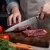 Import Professional 8-inch Stainless Steel Waved Pattern Blade Carving Meat Knife from China