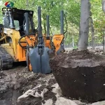 Skid Steer Loader the Front Part Tree Digging, Tree Uprooting, Tree Transplanting spade