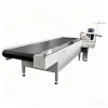 THE MACHINE OF HEMMING BY AUTOMATIC CONVEYOR BELT