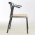 Import modern black metal frame natural plywood restaurant dining chair cafe chair on sale from China