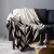 Import RAWHOUSE 100% cotton knitted nordic design pattern wholesale sofa cover throw woven blanket from China
