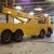 Import Shanghai heavy duty new condition flat bed road wrecker tow truck with Crane for sale from China