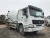 Import Used Good Condition SINOTRUK HOWO brand 25t self loading concrete mixer truck with pump for sale from Angola
