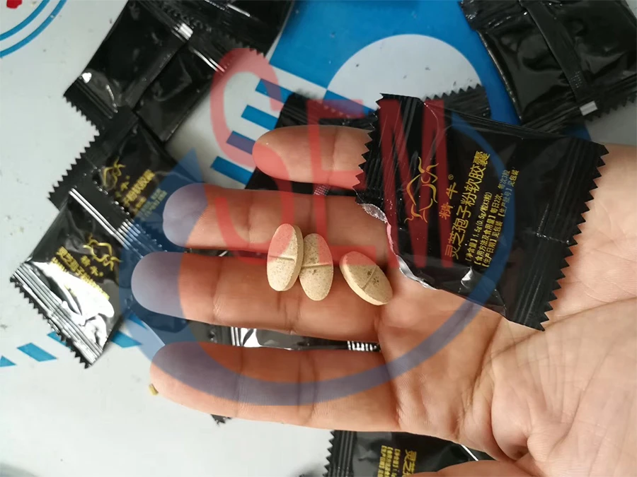 Automatic pill tablet pouch packaging machine