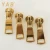 Import High Quality And Durable Custom Logo Pretty Golden Metal Zipper Sliders from China