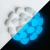 Import landscaping colorful luminous cobblestone pebble stone glow in the dark rocks from China