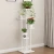 Import Modern 4 tier metal plant shelf black multi tiered rod iron plants stands from China