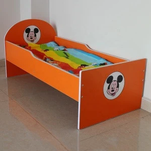 The kindergarten has a single wooden bed for babies to sleep in