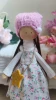 Handmade rag doll in a floral dress