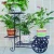 Import Living room corner steel flower pot black metal plant stand with two rear wheels from China