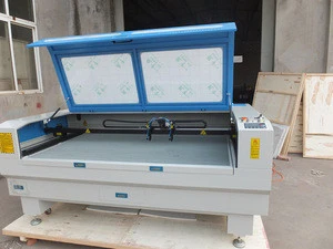 Remax 1410 co2 laser engraving machine for wood with high quality work table and can add rotary drill for handling cylinders