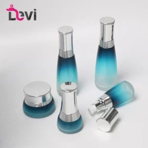 Devi Cosmetic skincare packaging blue body lotion glass bottle empty gold silver pump cream jar