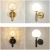 Import Hotel indoor decorative gold black metal modern led glass wall sconce from China