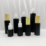 Luxury cosmetic fine mist black fronted glass spray perfume bottle with plastic pump and wooden lid black fronted glass jar