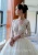 Import 2020 long sleeve real photos backless pearl button luxury beaded lace V neck sexy wedding dress from China