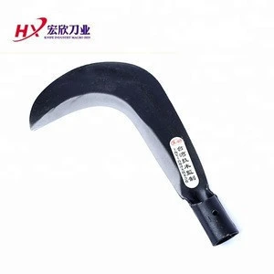 A new curved sickle with a wooden handle for cutting trees and cutting grass