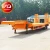 Import 3 axle 100ton lowbed trailer for carry bulldozer with hydraulic folding ramps from China