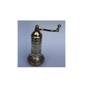 Coffee hand grinder with round base made in brass and polished finish