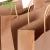 Import Custom New Design Handle Shopping Brown Kraft Paper Bag from China