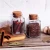 Import high quality 4oz small square spice glass jar with cork lid wood stopper bottle from China