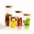 Import Home usage clear glass spice jar eco-friendly durable glass hermetic glass storage jars with wooden lid from China