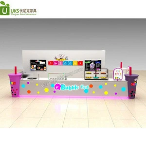 With big bubble tea cup modeling tea drinks prepare counter with topping mall food kiosk
