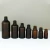 Import 3ml 5ml 10ml 15ml 30ml 50ml 100ml calabash frosted empty amber glass dropper bottle with black top for essential oil bottles from China
