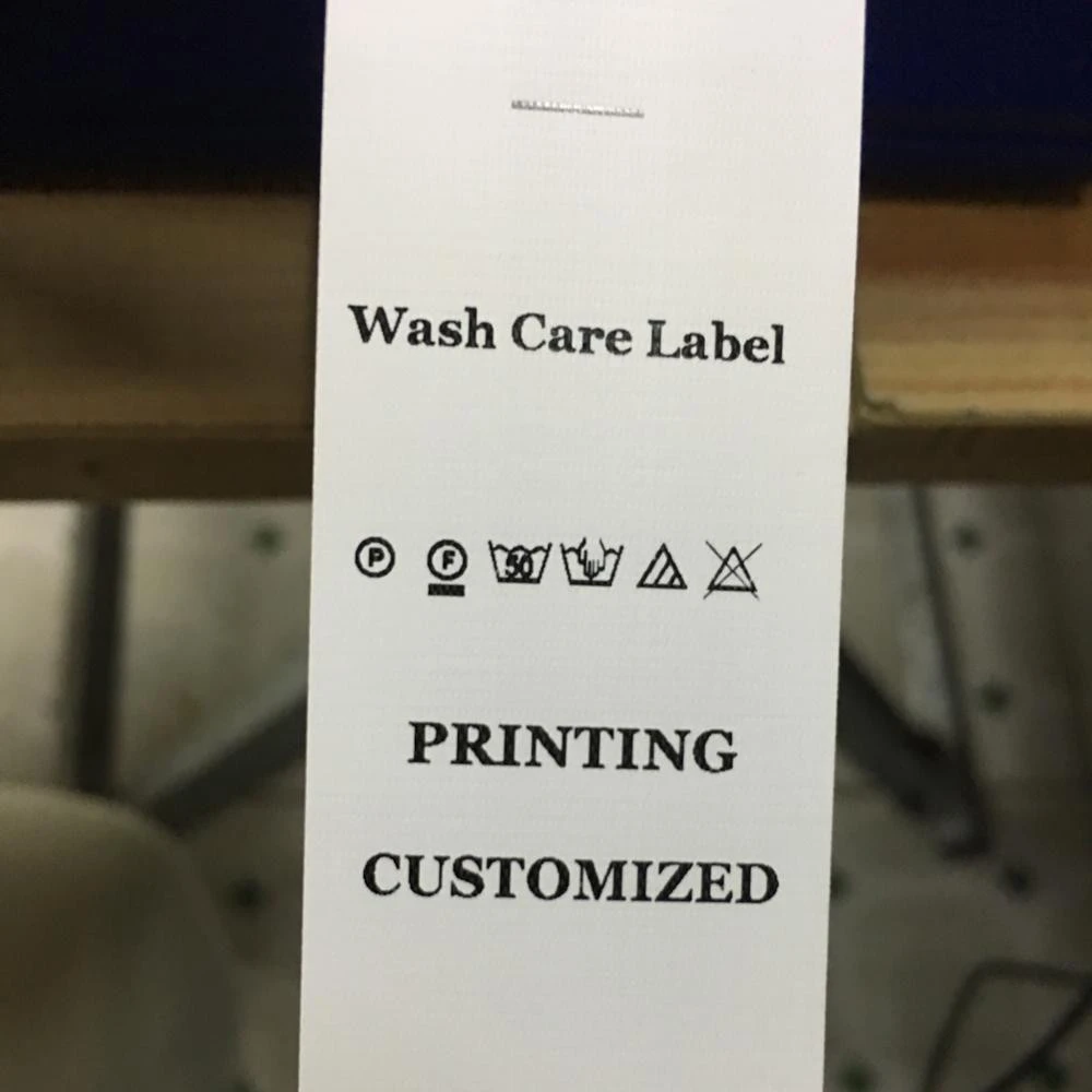 Printable wash care label roll in garment labels