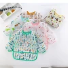 The new autumn style childrens overalls European style rice clothes K waterproof anti-wearing clothes eating clothes baby bibs