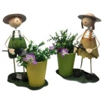 Wholesale Wrought Iron Plant Stands Outdoor Boy and Girl with Flowerpot for Garden Ornaments Planter