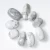 Import Factory price crystal healing stones Howlite oval irregular tumbled stones from China