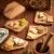 Import Eco-Friendly Puzzle Bamboo Wooden Snack Tray Dry Fruit Plate Charcuterie and Meat Serving Board Trays from China